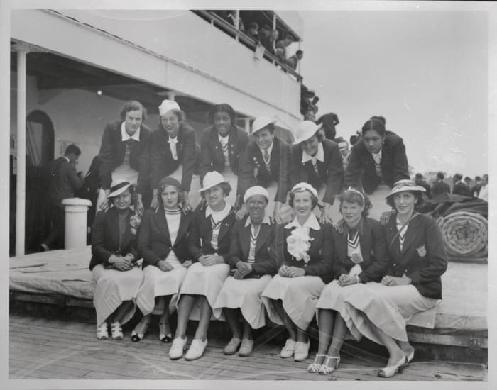 Stokes (third from left in back row) and Pickett (last in back row) returned to the U.S. on the SS President Roosevelt after being in Berlin for Olympics.